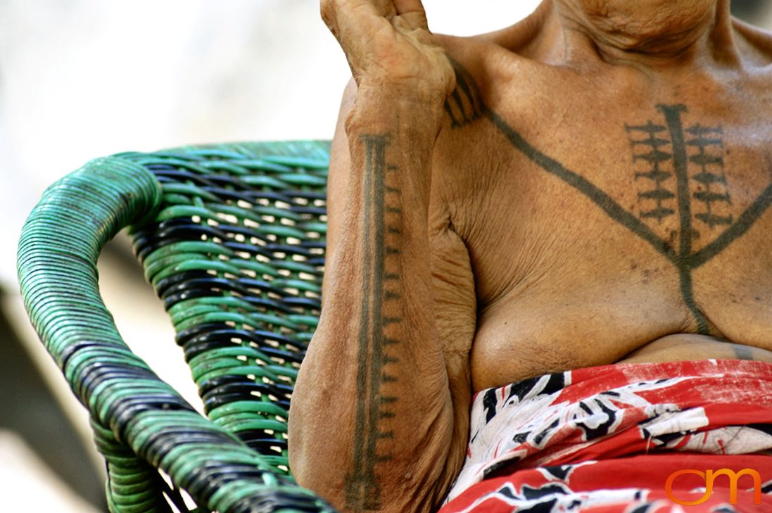 Photo of a woman with Solomon Island traditional tattoos. Taken on the island of Bellona by Amanda Fornal in December 2006.