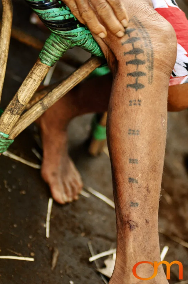 Photo of a woman with Solomon Island traditional tattoos. Taken on the island of Bellona by Amanda Fornal in December 2006.