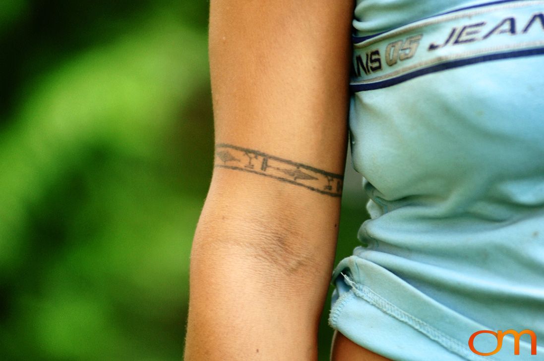 Photo of a woman with Solomon Island traditional tattoos. Taken on the island of Bellona by Amanda Fornal in December 2006.