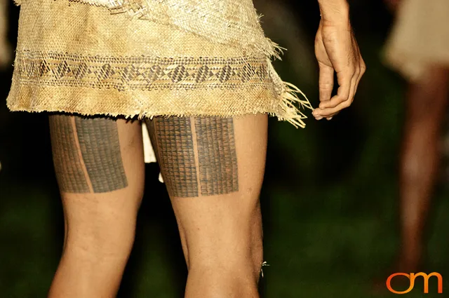 Photo of a man with Solomon Island traditional tattoos doing traditional dance. Taken on the island of Bellona by Amanda Fornal in December 2006.