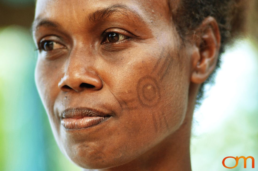 Photo of a woman with Solomon Island traditional facial scarification. Taken in the Malaita Province by Amanda Fornal in December 2006.