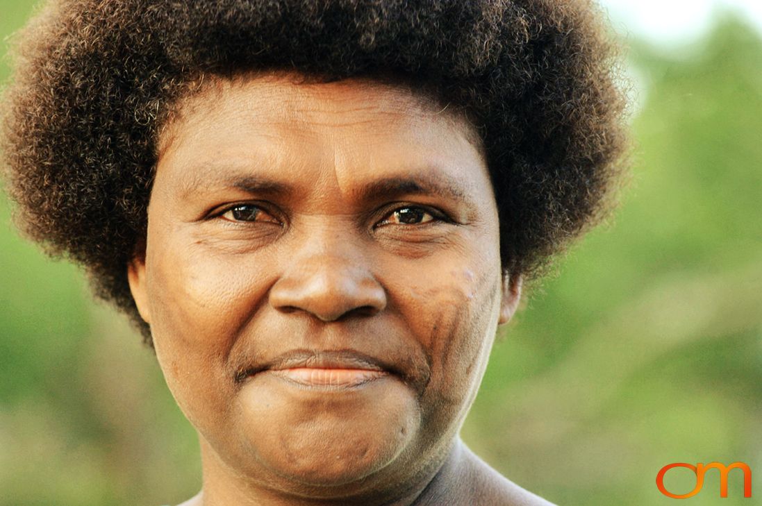 Photo of a woman with Solomon Island traditional facial scarification. Taken in the Malaita Province by Amanda Fornal in December 2006.