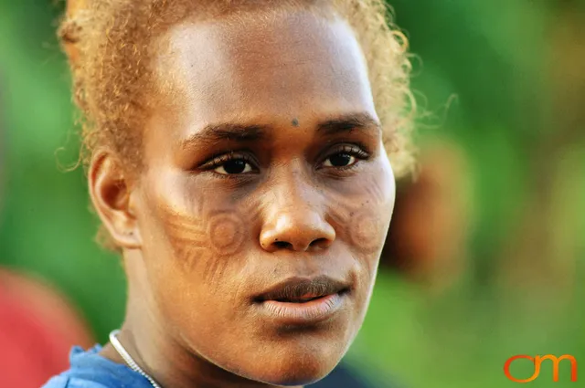 Photo of a woman with Solomon Island traditional facial scarification. Taken in the Malaita Province by Amanda Fornal in December 2006.