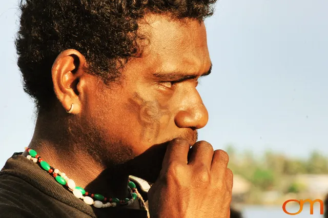 Photo of a man with Solomon Island traditional facial scarification. Taken in the Malaita Province by Amanda Fornal in December 2006.