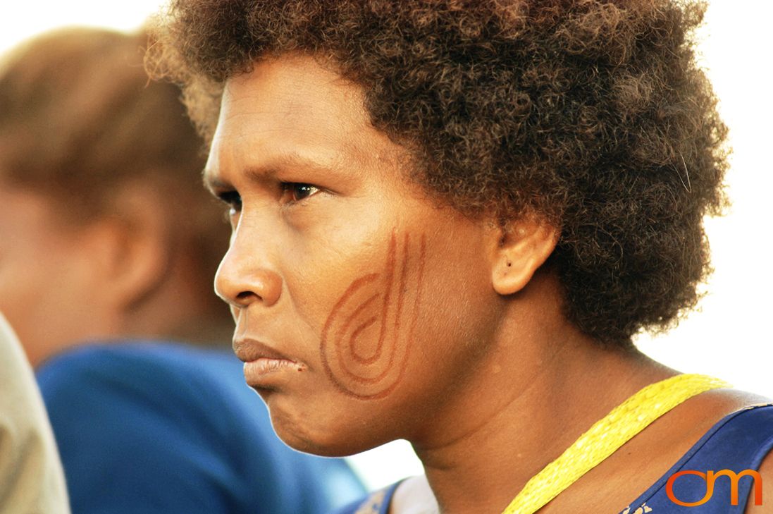 Photo of a woman with Solomon Island traditional facial scarification. Taken in the Malaita Province by Amanda Fornal in December 2006.