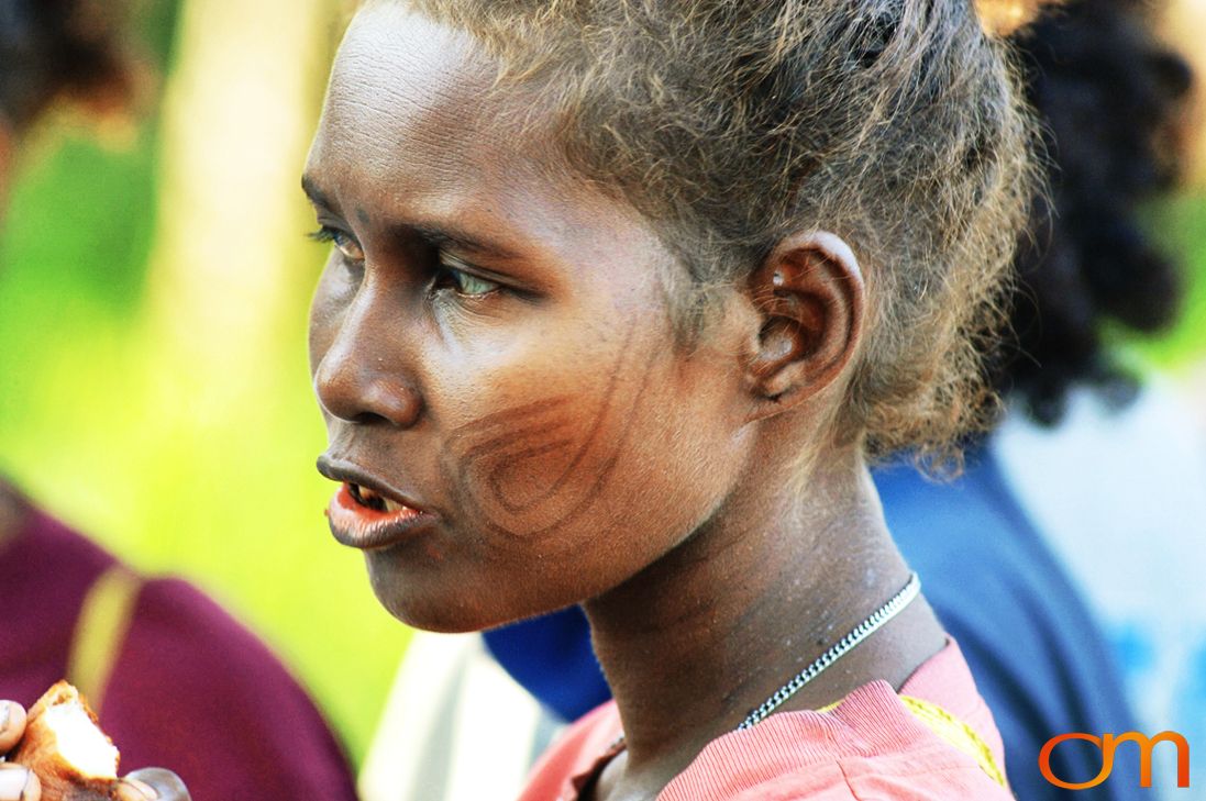 Photo of a woman with Solomon Island traditional facial scarification. Taken in the Malaita Province by Amanda Fornal in December 2006.