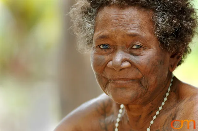 Photo of a woman with Solomon Island traditional tattoos. Taken in the Malaita Province by Amanda Fornal in December 2006.