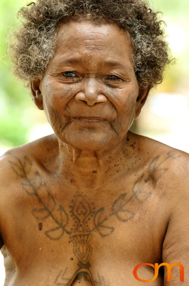 Photo of a woman with Solomon Island traditional tattoos. Taken in the Malaita Province by Amanda Fornal in December 2006.