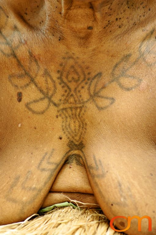 Photo of a woman's chest with Solomon Island traditional tattoos. Taken in the Malaita Province by Amanda Fornal in December 2006.