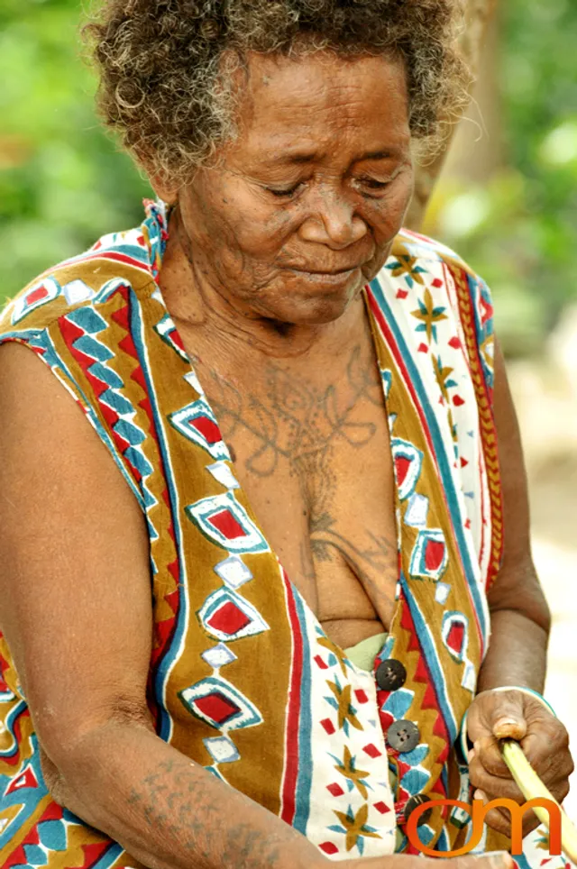 Photo of a woman with Solomon Island traditional tattoos. Taken in the Malaita Province by Amanda Fornal in December 2006.