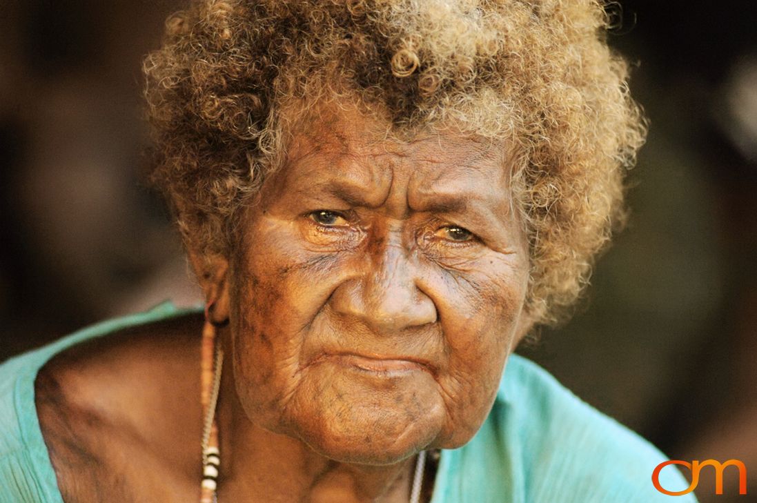 Photo of a woman with Solomon Island traditional facial tattoos. Taken in the Malaita Province by Amanda Fornal in December 2006.