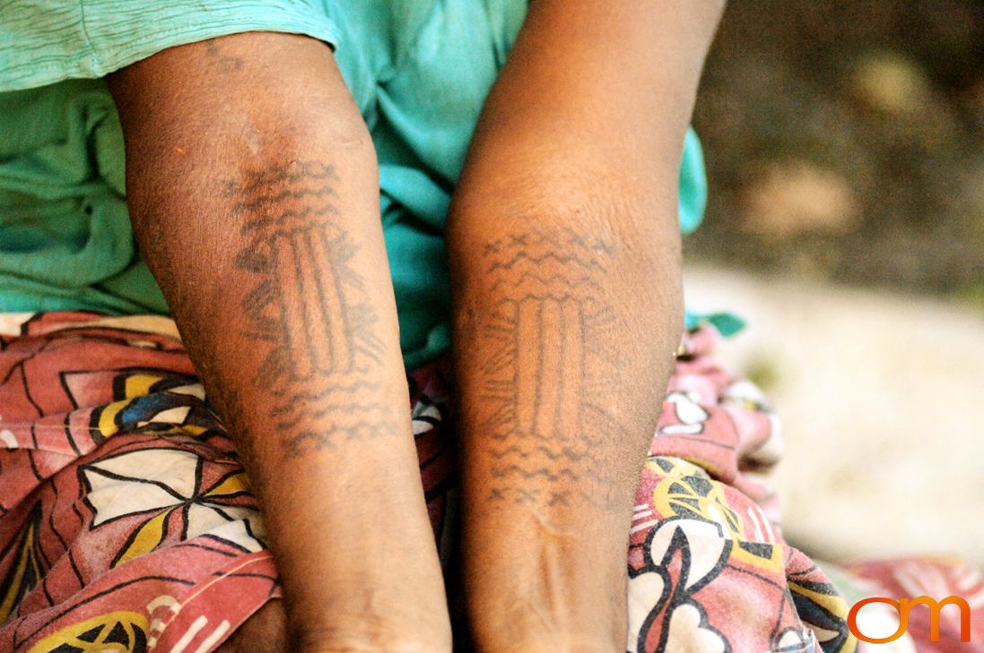 Photo of a woman's arms with Solomon Island traditional tattoos. Taken in the Malaita Province by Amanda Fornal in December 2006.