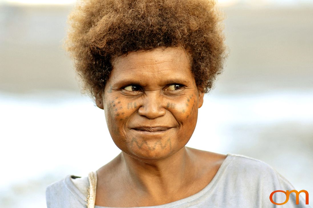 Photo of a woman with Solomon Island traditional face tattoos. Taken in the Malaita Province by Amanda Fornal in December 2006.