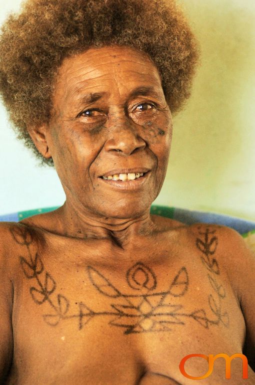 Photo of a woman with Solomon Island traditional tattoos. Taken in the Malaita Province by Amanda Fornal in December 2006.