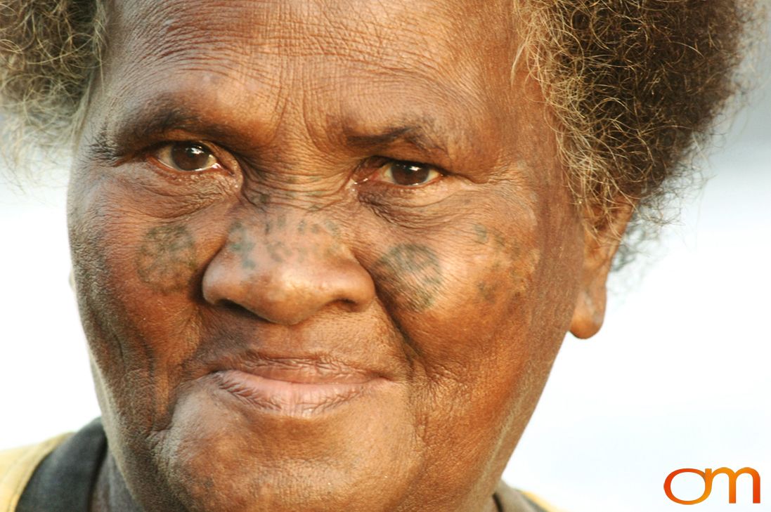 Photo of a woman with Solomon Island traditional face tattoos. Taken in the Malaita Province by Amanda Fornal in December 2006.