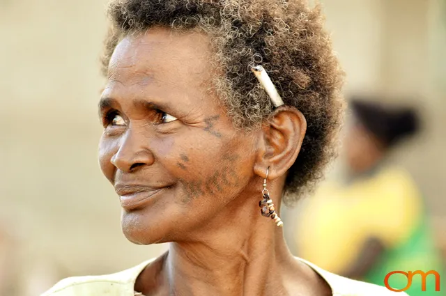 Photo of a woman with Solomon Island traditional face tattoos. Taken in the Malaita Province by Amanda Fornal in December 2006.