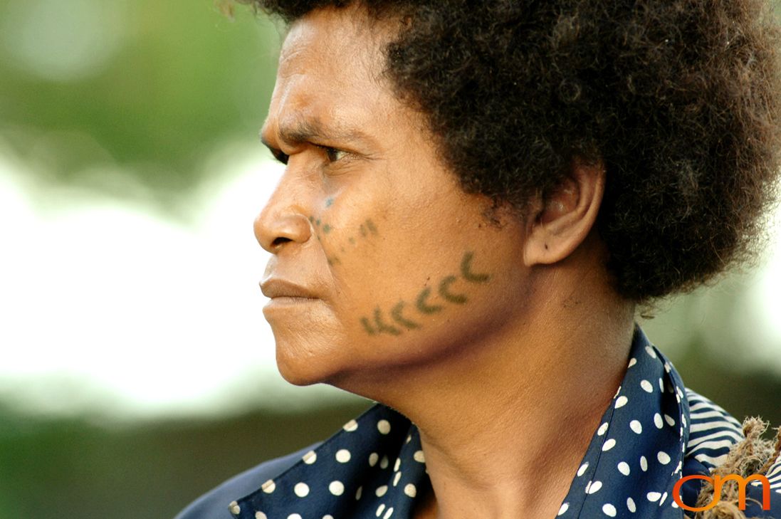 Photo of a woman with Solomon Island traditional face tattoos. Taken in the Malaita Province by Amanda Fornal in December 2006.