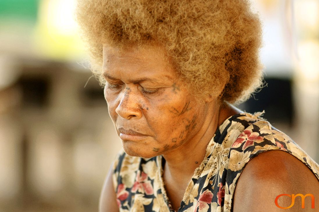 Photo of a woman with Solomon Island traditional face tattoos. Taken in the Malaita Province by Amanda Fornal in December 2006.