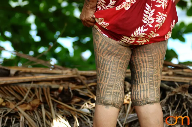 Photo of a woman with Solomon Island Ontong Java traditional leg tattoos. Taken in the Malaita Province by Amanda Fornal in December 2006.