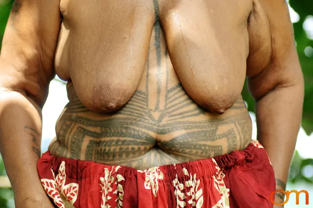 Photo of a woman with Solomon Island Ontong Java traditional tattoos. Taken by Amanda Fornal in December 2006.