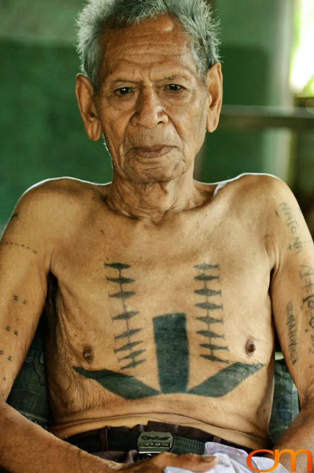 Photo of Solomon Island traditional tattoo on a man's chest. Taken of Timoseus on the island of Rennell by Amanda Fornal in December 2006.