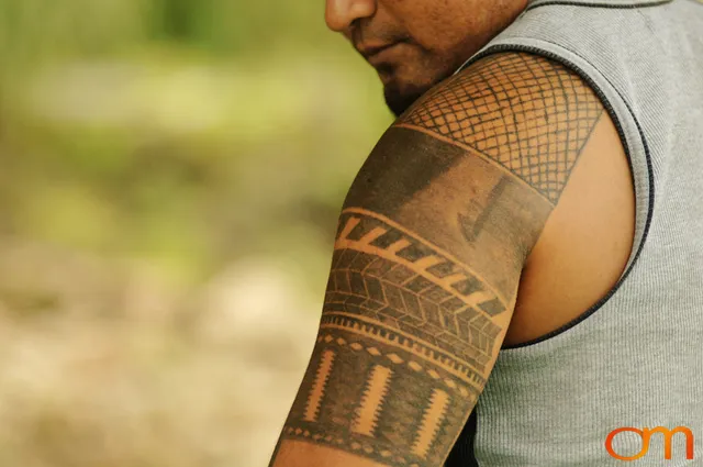 Photo of Solomon Island traditional tattoo on a man's shoulder. Taken of Wes on the island of Rennell by Amanda Fornal in December 2006.