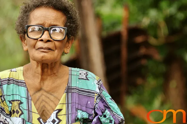 Photo of Vanuatu woman with a traditional tattoo on her chest. Taken of Catherine on the Vanuatu Island of Ambae by Amanda Fornal in December 2006.