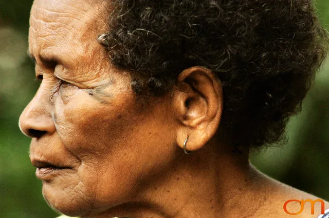 Photo of Vanuatu woman with a traditional tattoo on her face. Taken of Catherine on the Vanuatu Island of Ambae by Amanda Fornal in December 2006.