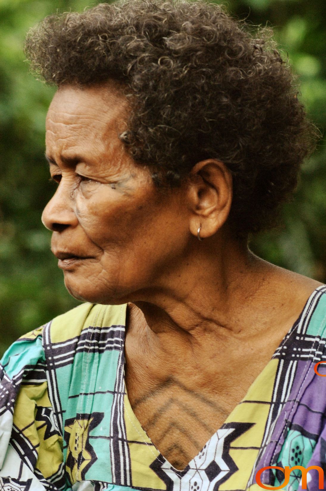 Photo of Vanuatu woman with a traditional tattoo on her face. Taken of Catherine on the Vanuatu Island of Ambae by Amanda Fornal in December 2006.