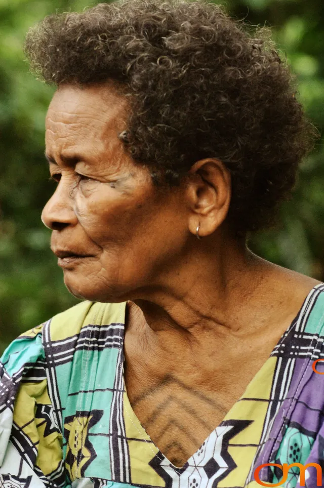 Photo of Vanuatu woman with a traditional tattoo on her face. Taken of Catherine on the Vanuatu Island of Ambae by Amanda Fornal in December 2006.