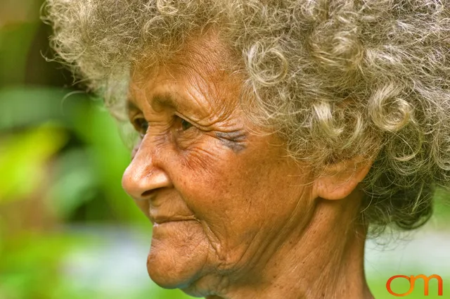 Photo of Vanuatu woman with a traditional tattoo on her face. Taken of Julliet on the Vanuatu Island of Ambae by Amanda Fornal in December 2006.