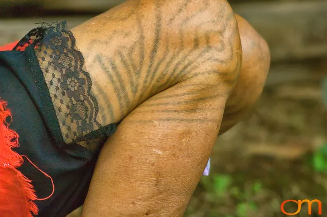 Photo of Vanuatu woman with a traditional tattoo on her legs. Taken of Julliet on the Vanuatu Island of Ambae by Amanda Fornal in December 2006.