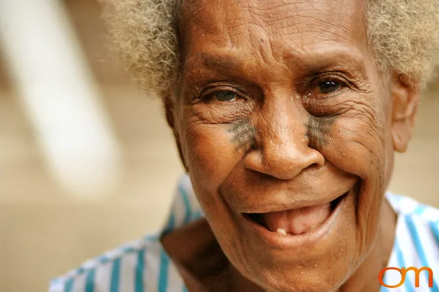 Photo of Vanuatu woman with a traditional tattoo on her face. Taken of Sarah on the Vanuatu Island of Mota Lava by Amanda Fornal in December 2006.