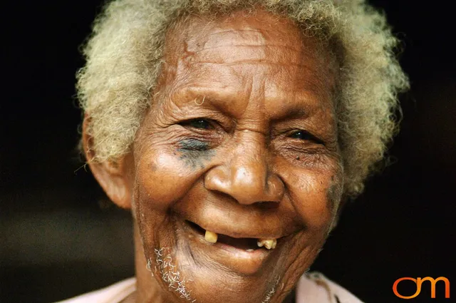 Photo of Vanuatu woman with a traditional tattoo on her face. Taken on the Vanuatu Island of Mota Lava by Amanda Fornal in December 2006.