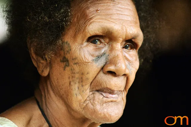 Photo of Vanuatu woman with a traditional tattoo on her face. Taken on the Vanuatu Island of Mota Lava by Amanda Fornal in December 2006.