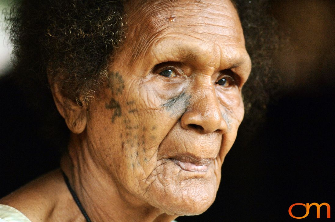 Photo of Vanuatu woman with a traditional tattoo on her face. Taken on the Vanuatu Island of Mota Lava by Amanda Fornal in December 2006.