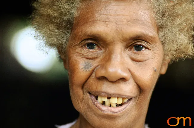 Photo of Vanuatu woman with a traditional tattoo on her face. Taken on the Vanuatu Island of Mota Lava by Amanda Fornal in December 2006.