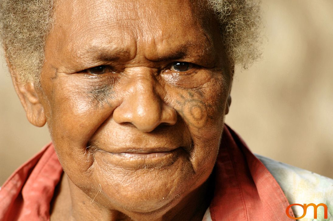 Photo of Vanuatu woman with a traditional tattoo on her face. Taken on the Vanuatu Island of Mota Lava by Amanda Fornal in December 2006.