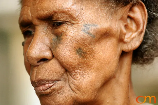 Photo of Vanuatu woman with a traditional tattoo on her face. Taken on the Vanuatu Island of Mota Lava by Amanda Fornal in December 2006.