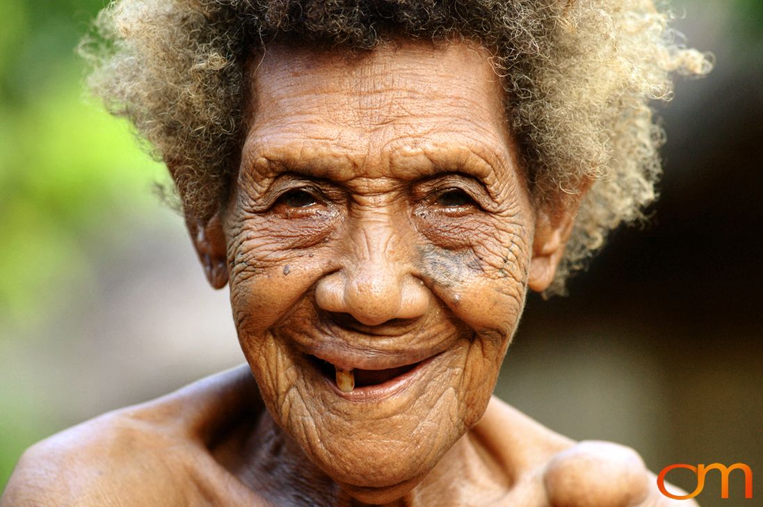 Photo of Vanuatu woman with a traditional tattoo on her face. Taken on the Vanuatu Island of Mota Lava by Amanda Fornal in December 2006.