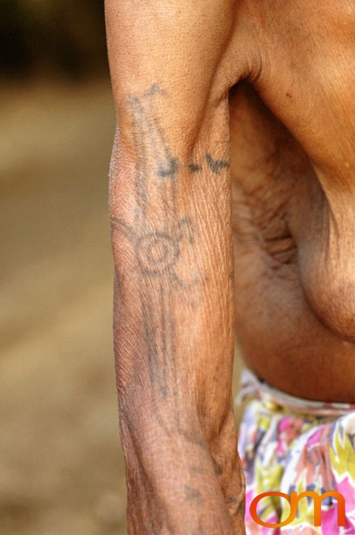 Photo of Vanuatu woman with a traditional tattoo on her arm. Taken on the Vanuatu Island of Mota Lava by Amanda Fornal in December 2006.