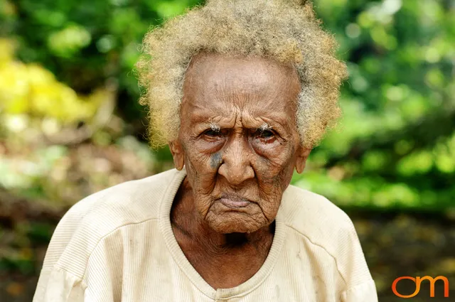 Photo of Vanuatu woman with a traditional tattoo on her face. Taken on the Vanuatu Island of Mota Lava by Amanda Fornal in December 2006.