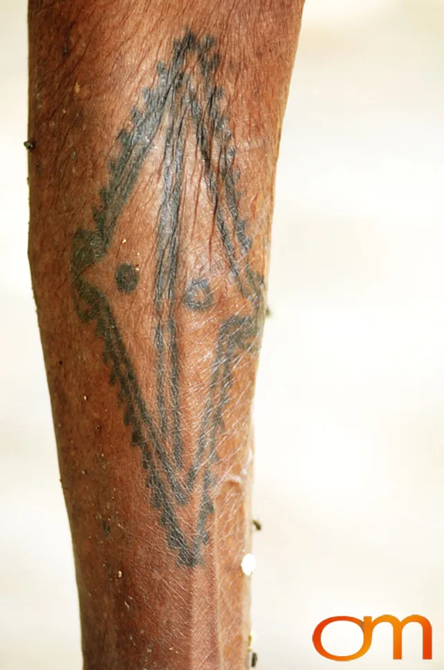 Photo of Vanuatu woman with a traditional tattoo on her leg. Taken on the Vanuatu Island of Mota Lava by Amanda Fornal in December 2006.