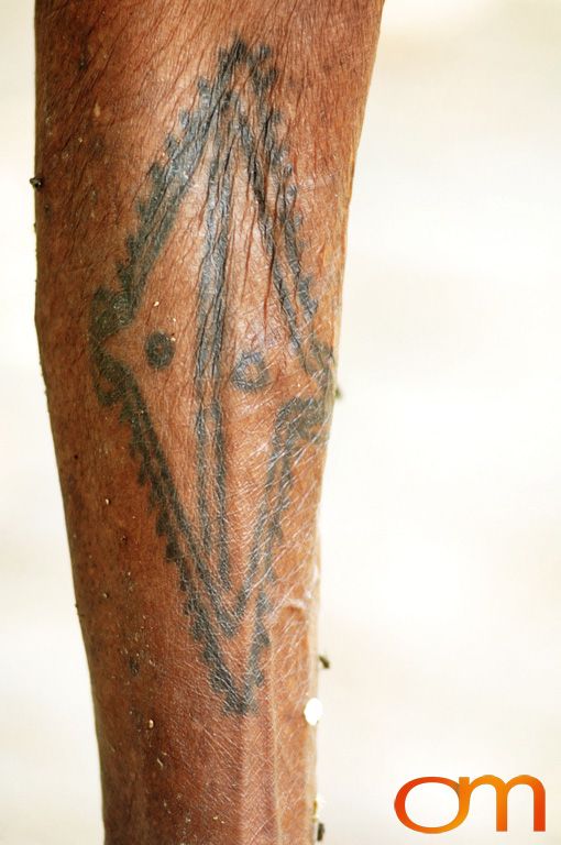 Photo of Vanuatu woman with a traditional tattoo on her leg. Taken on the Vanuatu Island of Mota Lava by Amanda Fornal in December 2006.